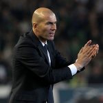 Real Madrid coach Zidane gestures during a game.